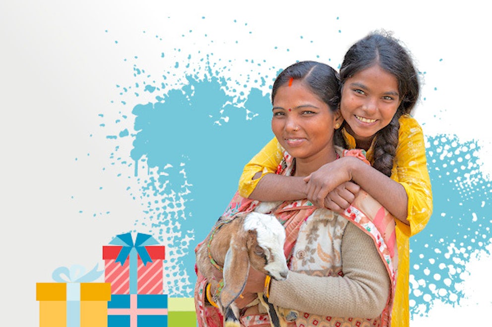 Sandhaya and her daughter hold a goat.