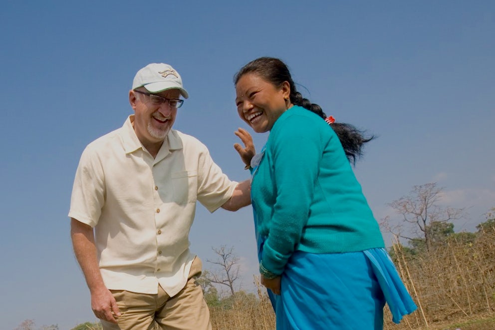 Pierre Ferrari, CEO of Heifer, shares a laugh with a project participant.