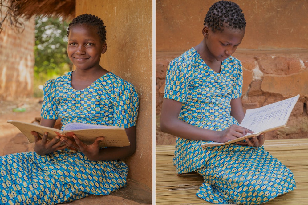 Precious reads from her school notebook while sitting outside her home.