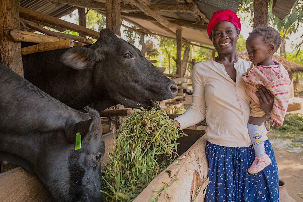 Family with their Heifer.