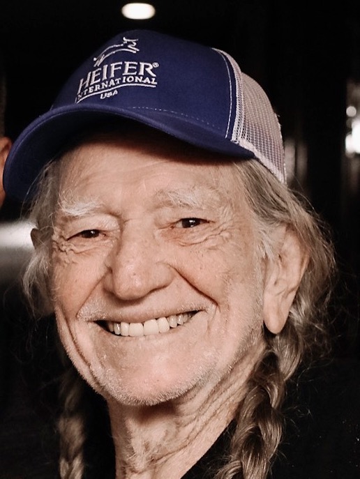 Willie Nelson sports a Heifer USA hat on his tour bus before performing in Troutdale, Oregon.