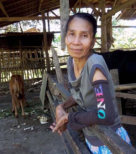 Pilipine Geldore stands with her Lalay in the cow shed.