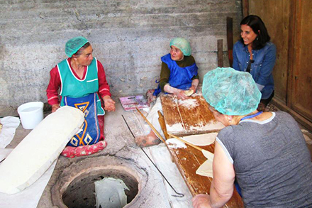 Tourist makes lavash with local bakers