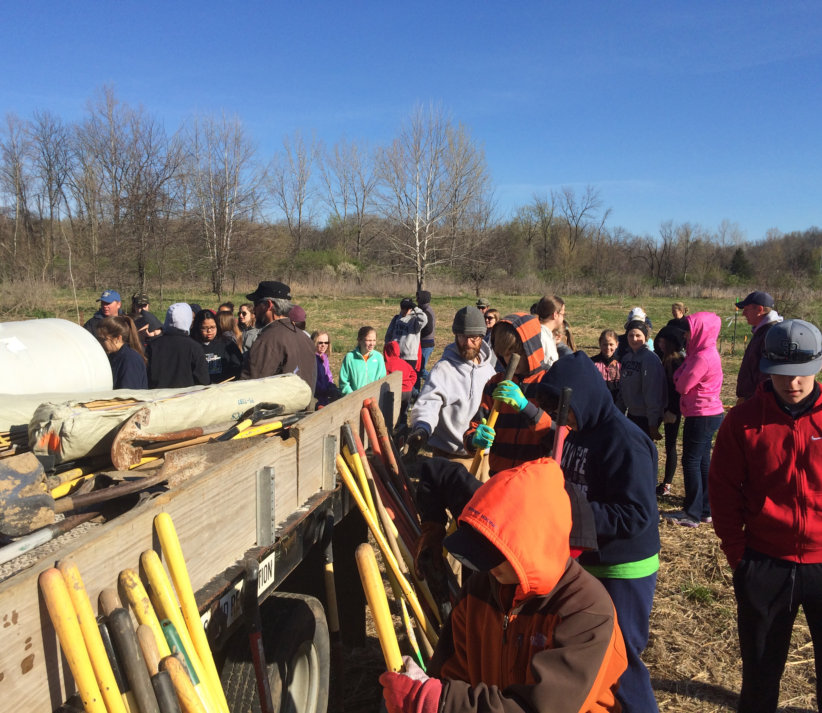 Heifer volunteers from Missouri UMC and Rock Bridge High School join Columbia Parks and Recreation to plant almost 900 trees as part of a flood control project.