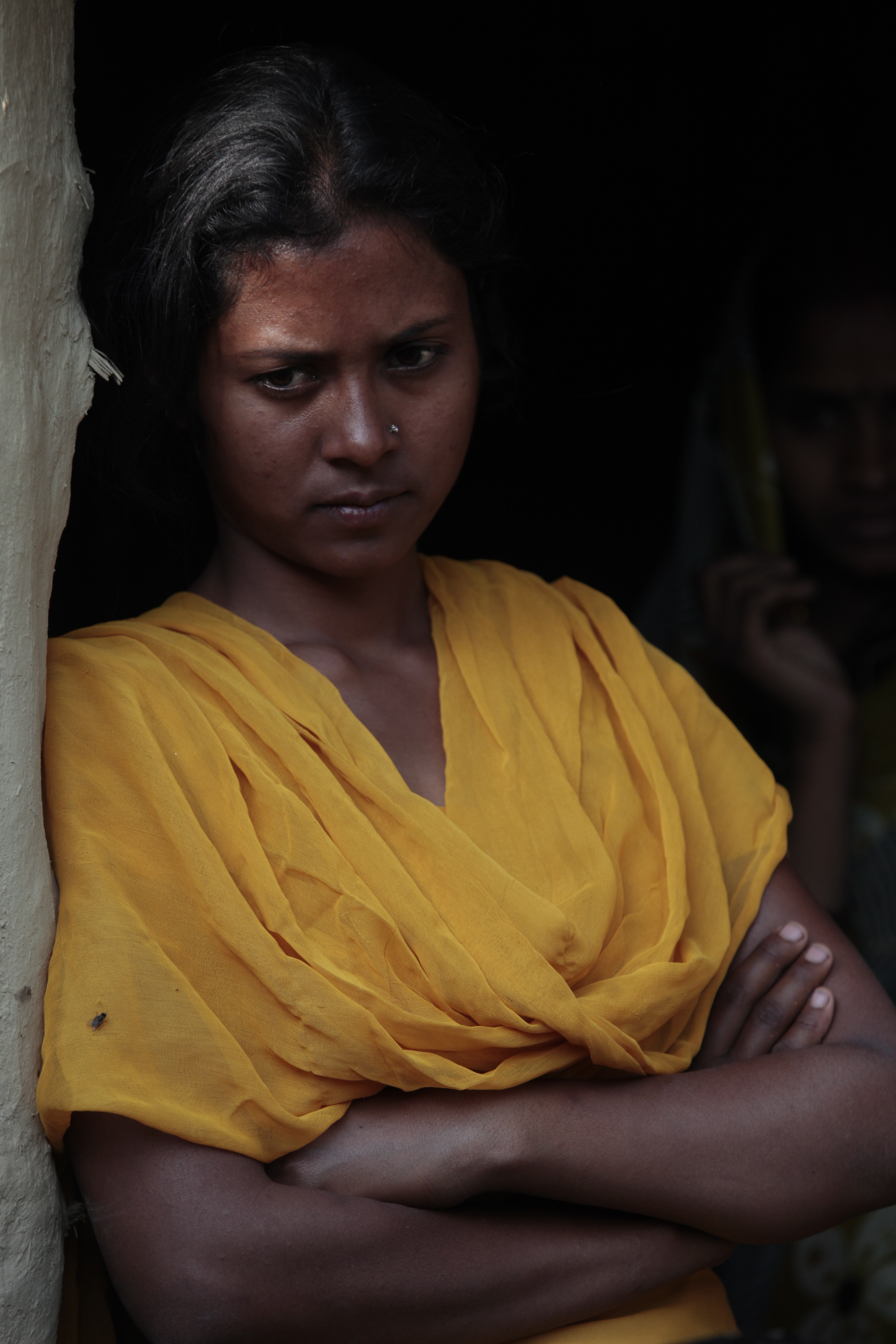 Heifer project participant Lilawati Devi listens during a group meeting. 