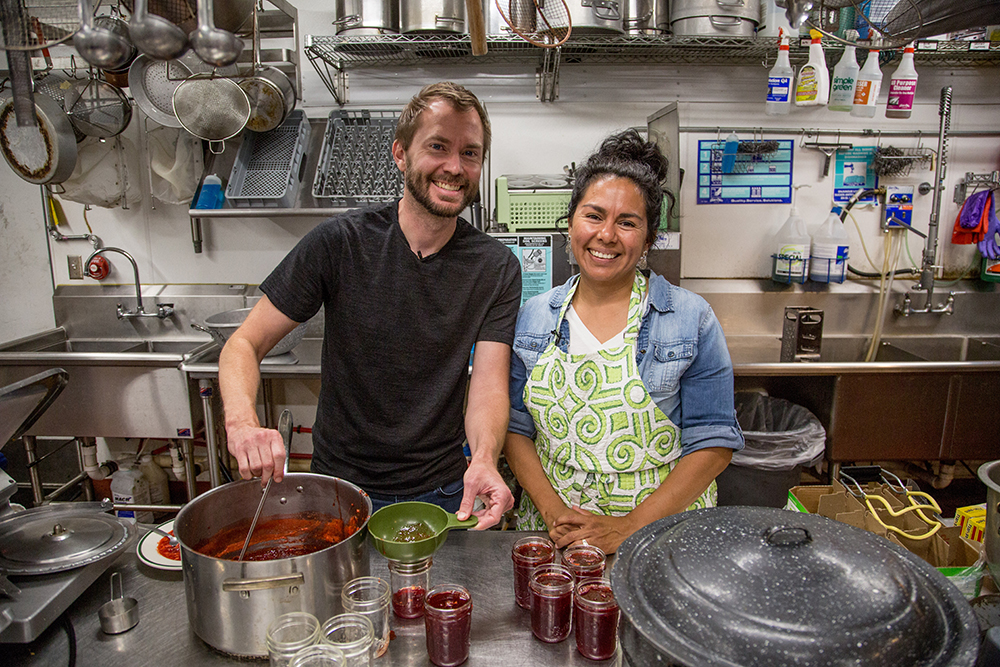 Teriney Tobler teaches World Ark reporter Jason Woods how to make her famous strawberry jam.