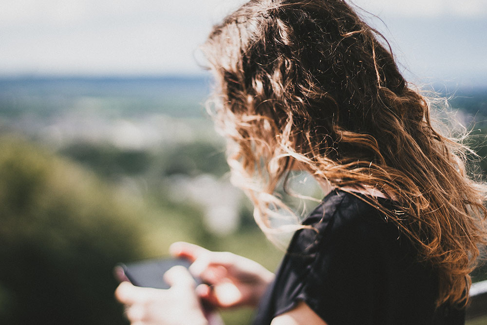 A girl texting on her phone.