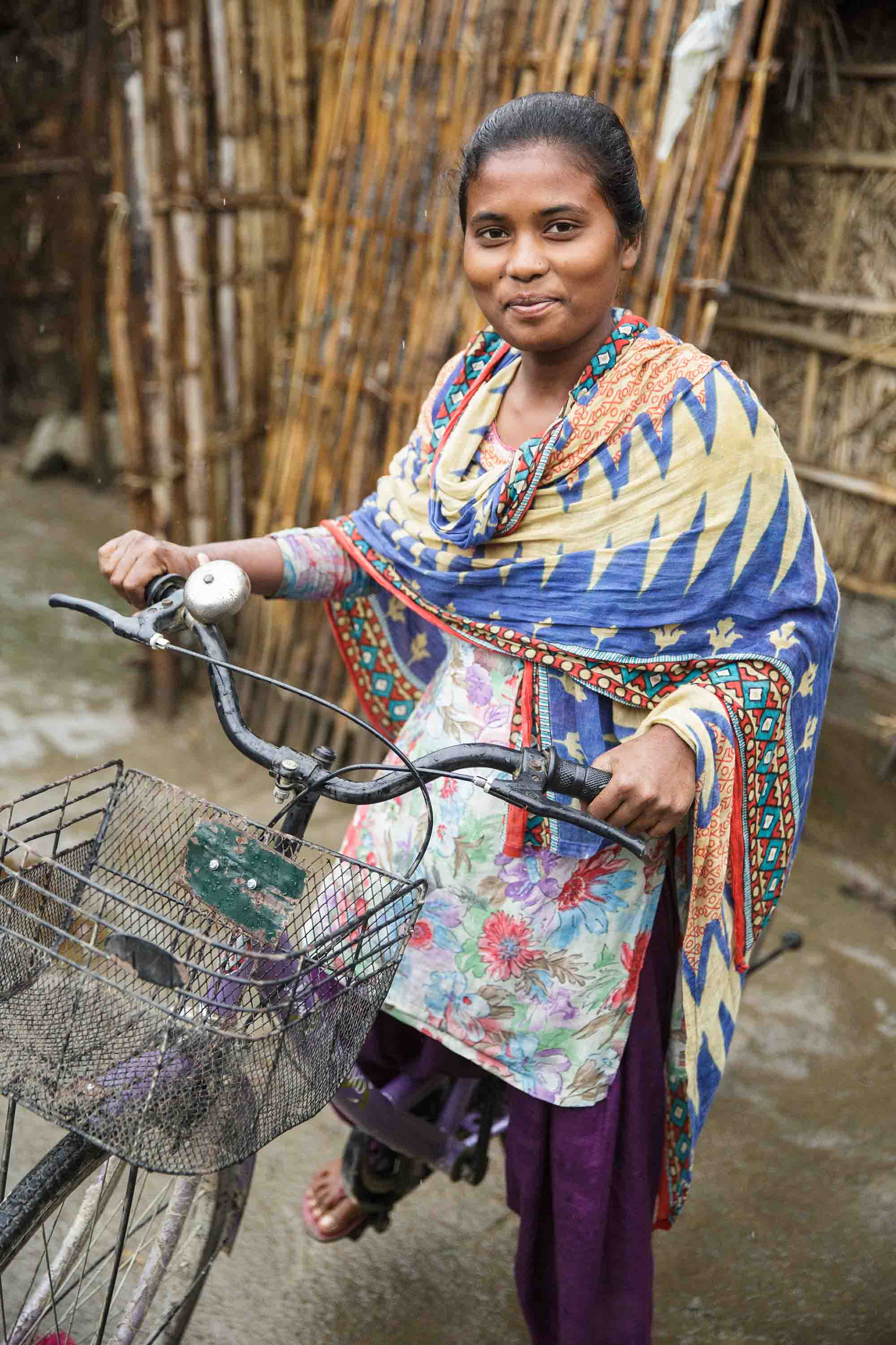 Rashmi Kisku rides her bicycle.