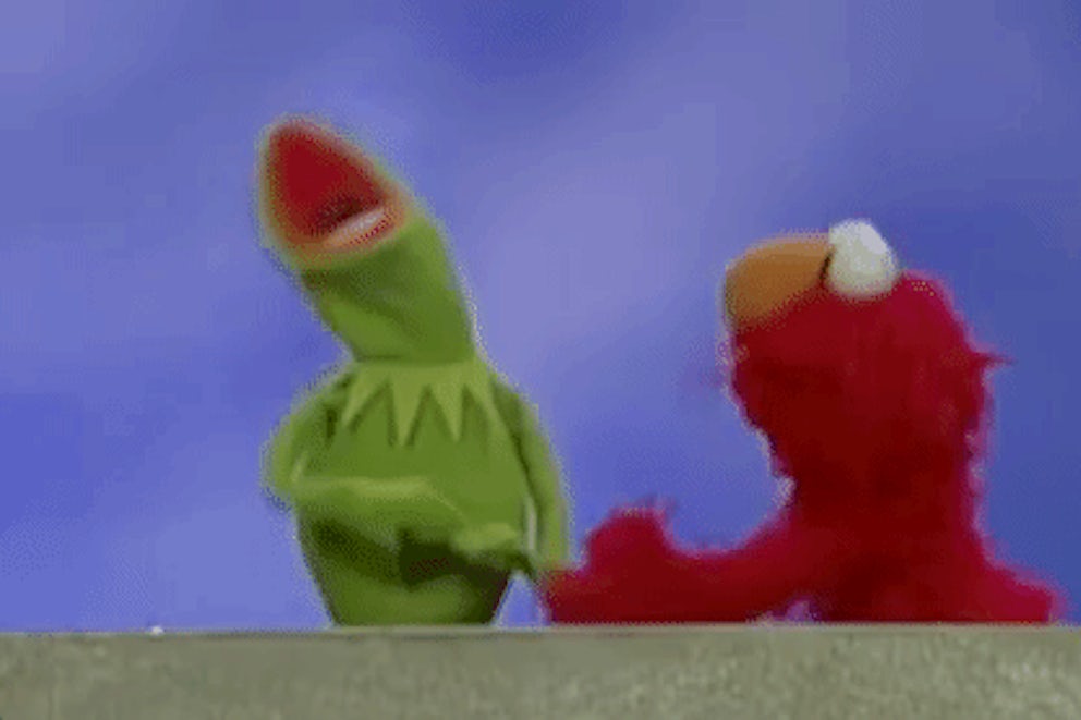 A GIF of muppets Kermit and Elmo apparently yelling and flailing.