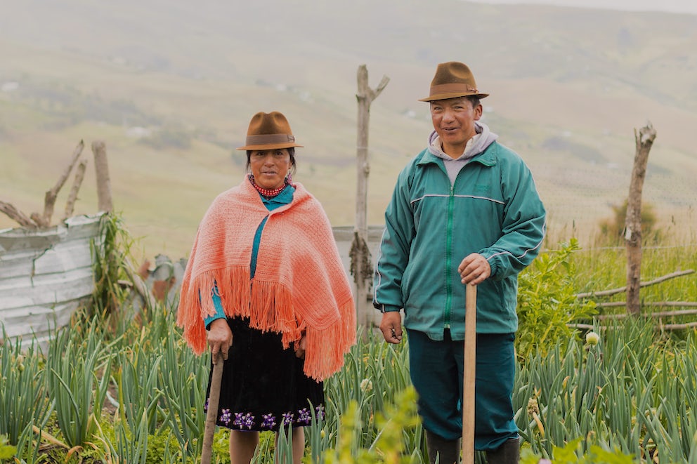 María Rosa Iza Cuchiparte wears her warm pollera even while working in the garden.