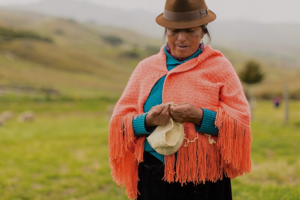 María Rosa Iza Cuchiparte and many other Quechua women mix vibrant color and texture combinations with their sweaters and shawls.
