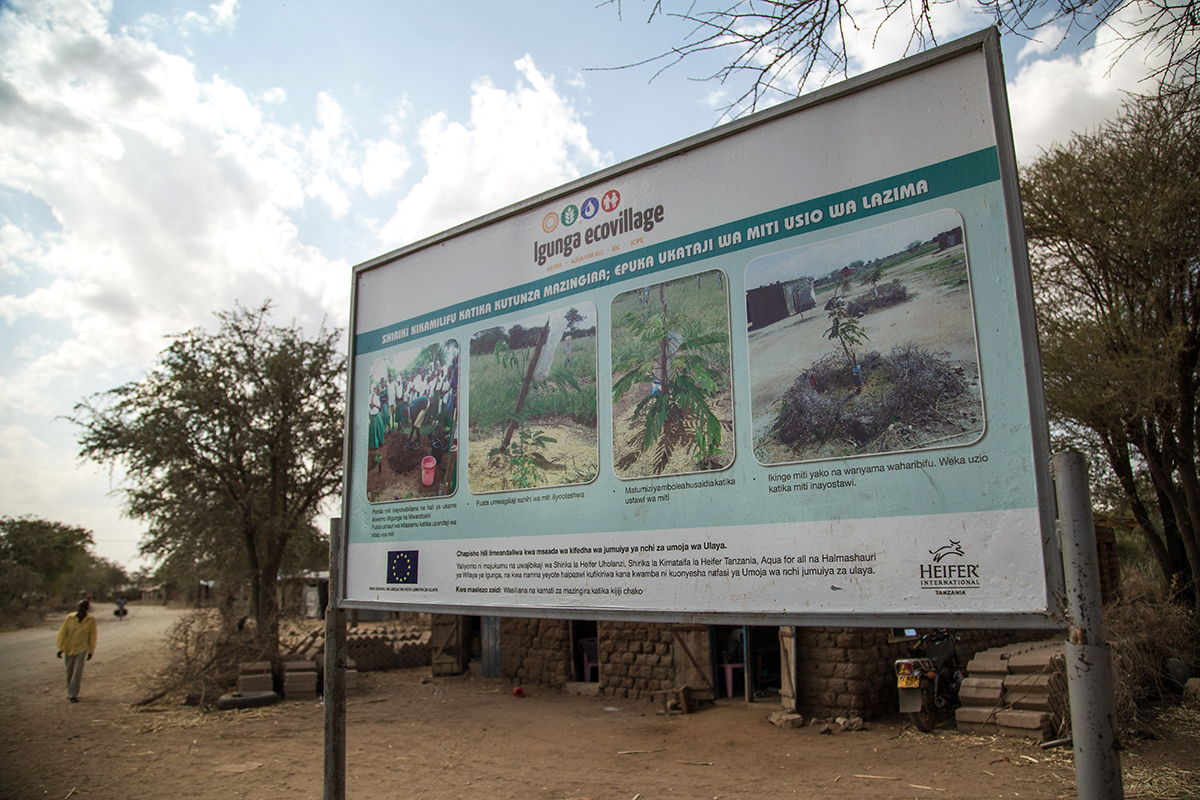 A large sign deptics educational information on agricultural practices.