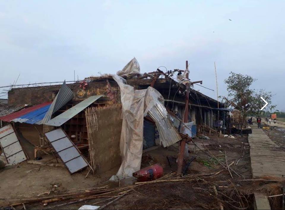 A collapsed in home with scattered debris.