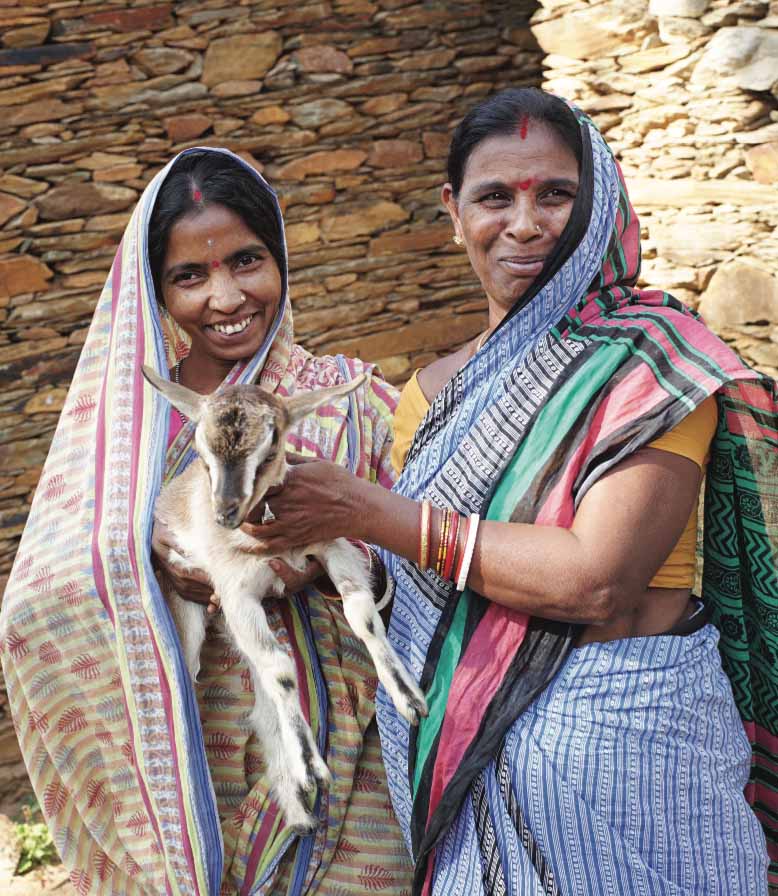 Anusaya Naik (right) decided to share a goat with a neighbor, setting off a chain of giving in Odisha. 