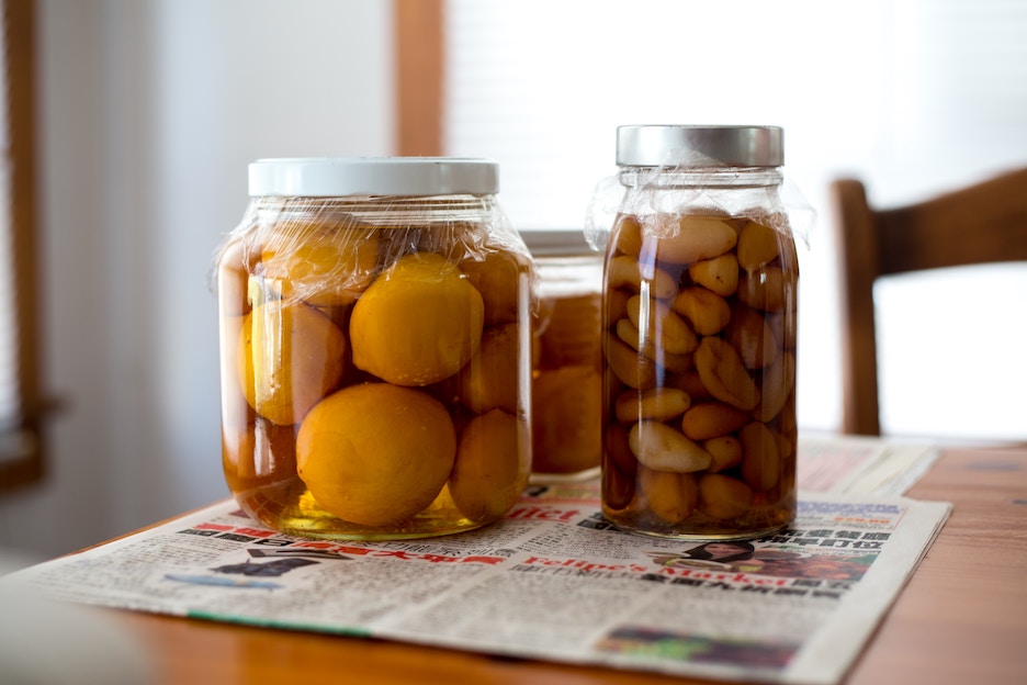 Lemons and garlic ferment in jars. Photo by Lason Leung/Unsplash