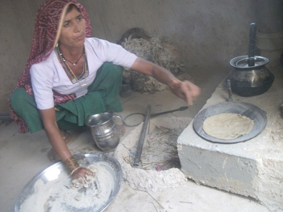 Gaura Devi cooking on her new smokeless stove.