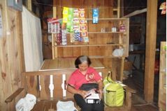 A Heifer International project participant works at a food cooperative in the Philippines