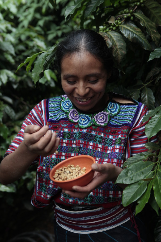 Feliciana, 26, holds coffee near her home in the village of Tuiboch in Huehuetenango, Guatemala. Photo by Russell Powell, courtesy of Heifer International.