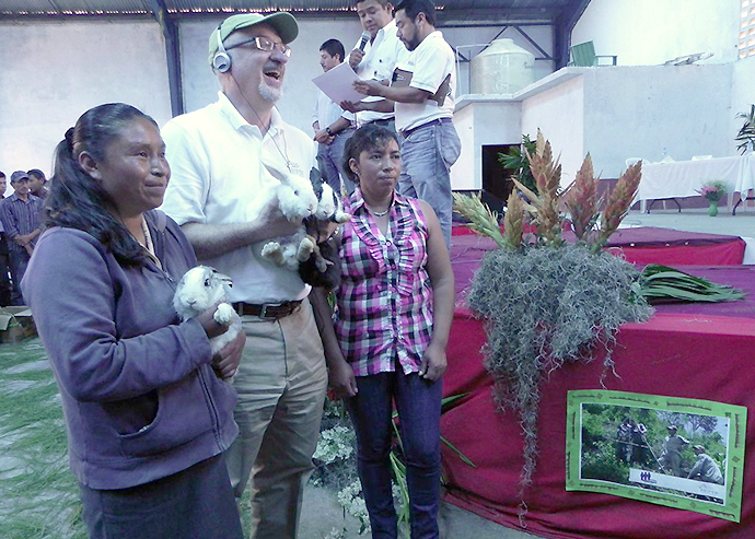 Heifer's President and CEO Pierre Ferrari celebrates with project participants during a Passing on the Gift® ceremony in Guatemala. Photo courtesy of Heifer International