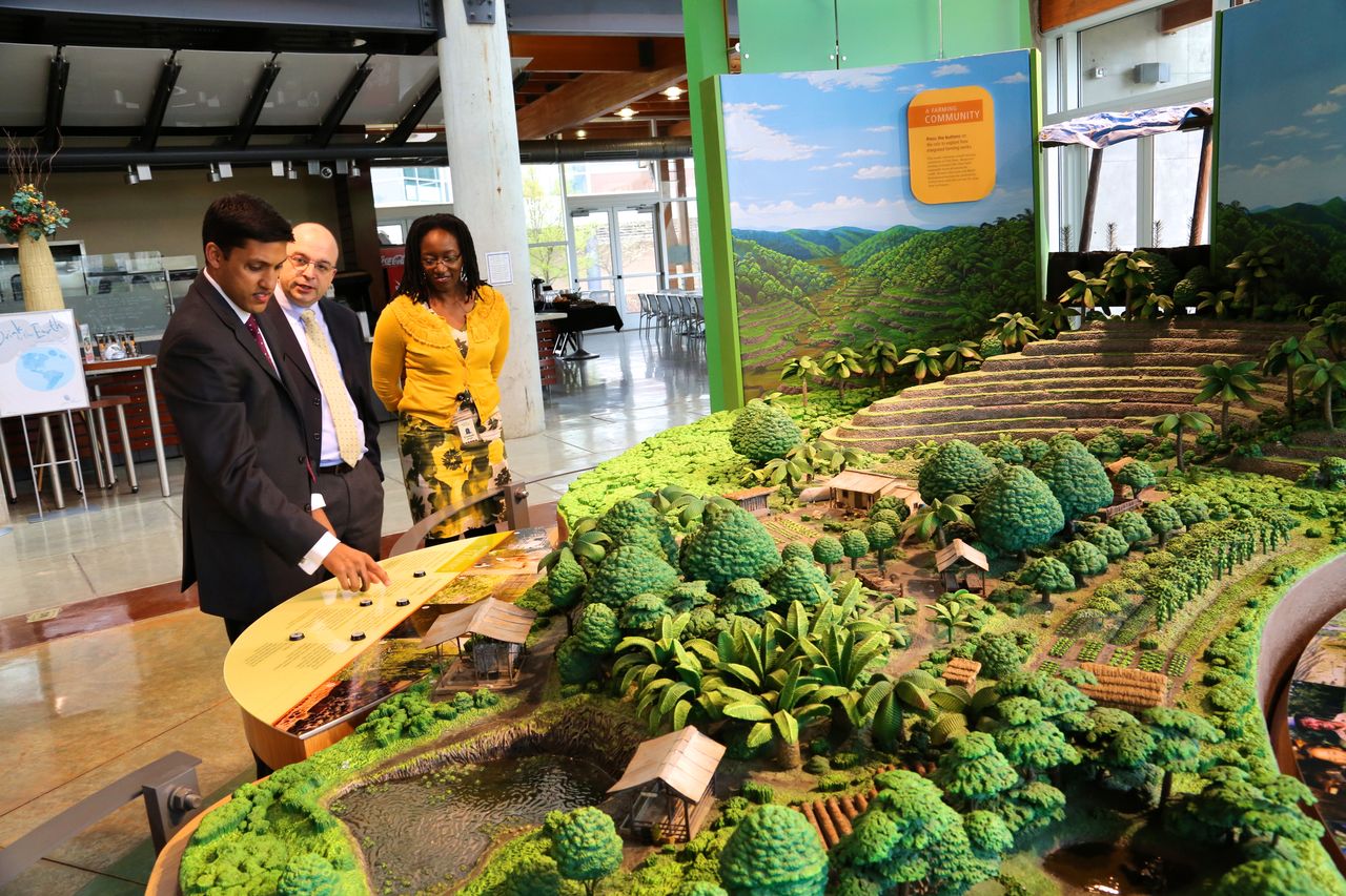 Dr. Raj Shah, USAID Administrator, reviews Heifer Village's integrated farming model. He was escorted by Pietro Turilli, Vice President for Partnerships and Business Development and Elizabeth Bintliff, Vice President for Africa Program