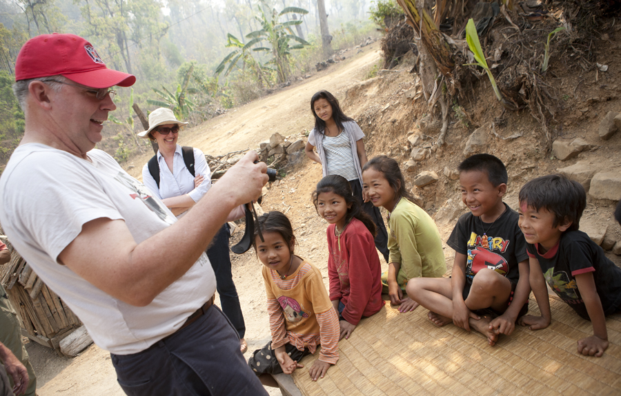 Heifer Board member Jay Whittmeyer, who is fluent in Nepalese, jokes with children in Shaktikhor. Photo by Geoff Oliver Bugbee