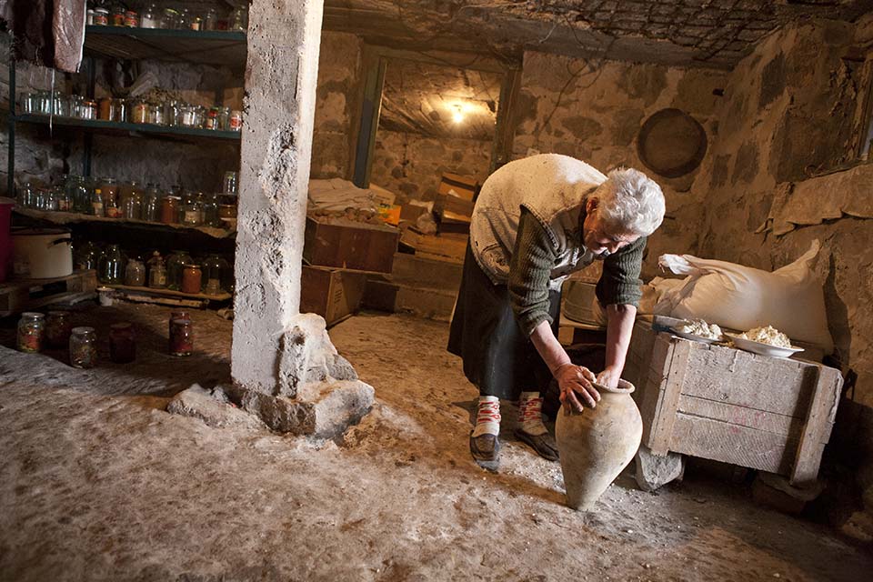 Teghenik, Armenia — Heifer beneficiary Tsovinar Davtyan prepares cheese, the sale of which supports her children and grandchildren. Photo by Geoff Oliver Bugbee