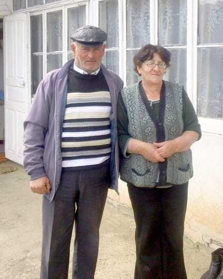Seyran and his wife stand in front of their home. Photo by Sergey Meloyan, CARMAC Project Coordinator, Heifer Armenia