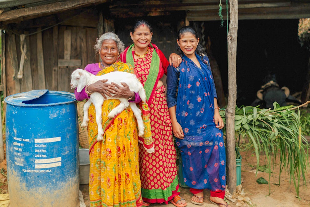 Women in Nepal with one of their goats