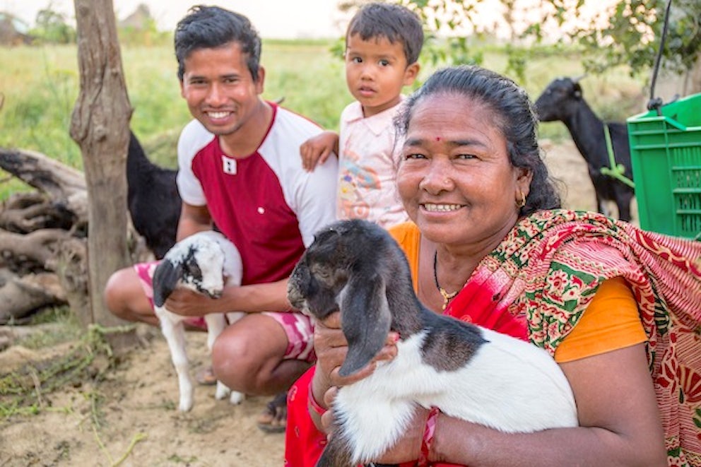 Jit and her family holding goats