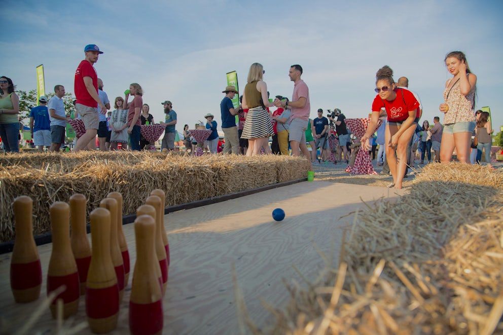 woman bowling on lawn at Urban Farm Fest