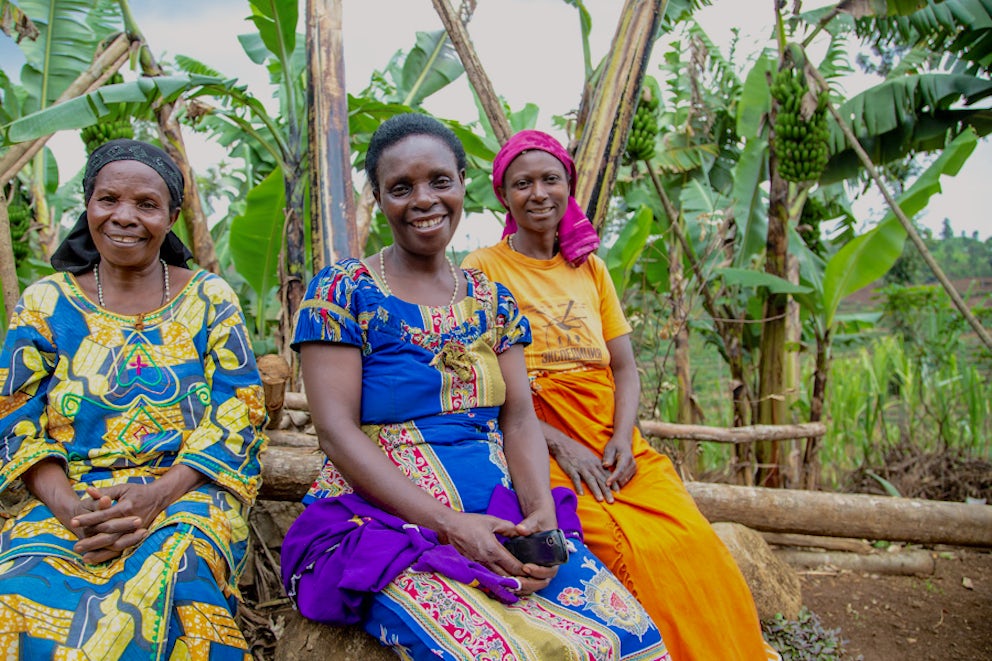 three women sitting next to each other and smiling