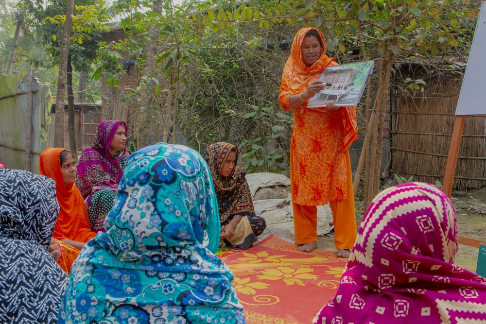 Aeysha teaches a group about animal husbandry in Kachutia village.