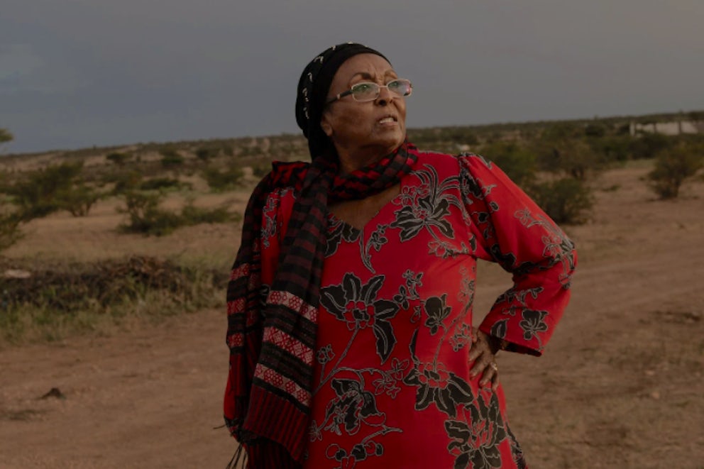 Edna Adan standing in a field