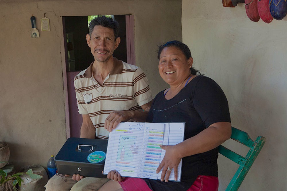 Woman and Man working on a ledger.