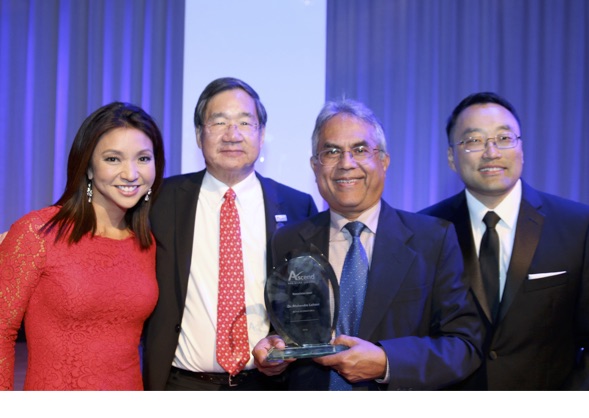 Mahendra Lohani receives the Humanitarian Award at the Ascend National Convention. Pictured is Sandra Endo, Fox 11 Reporter, Jeff Chin, Ascend National President, Mahendra Lohani, and Thomas Phelps IV, Laserfiche.
