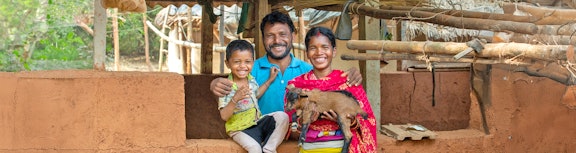 A family in India with their goat