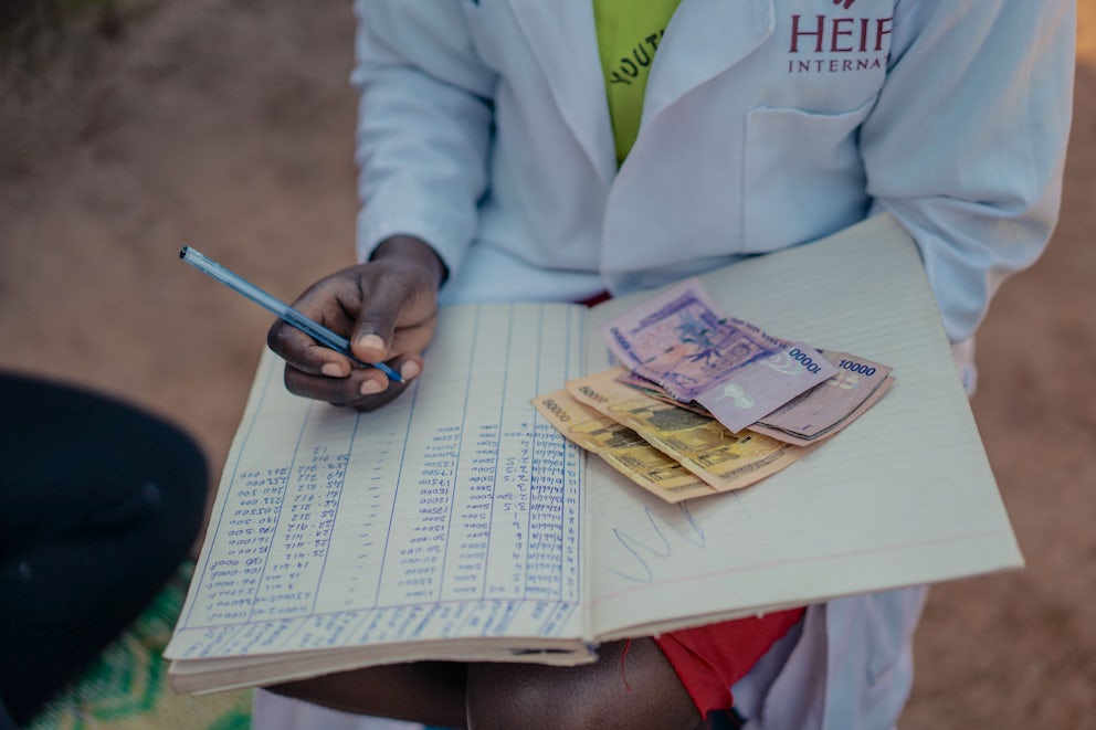 A close up of a young farmer conducting bookkeeping.