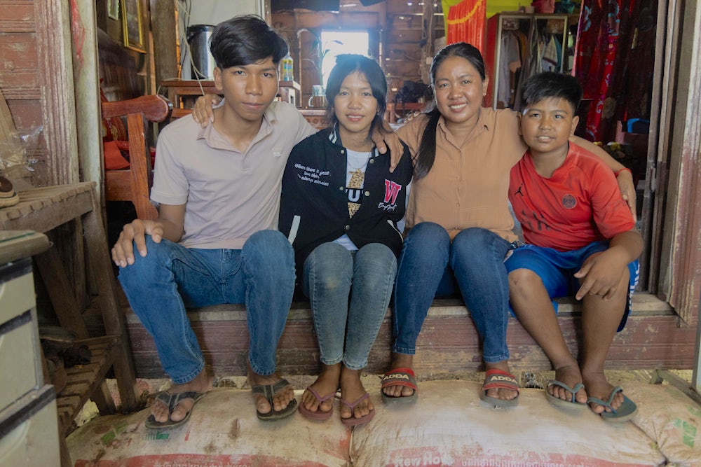 Set Hach poses proudly with her children. Left to right: Hoeum Bunhong (17), Hoeum Seyha (14), Set Hach (37) and Hoeum Lyhean (11).