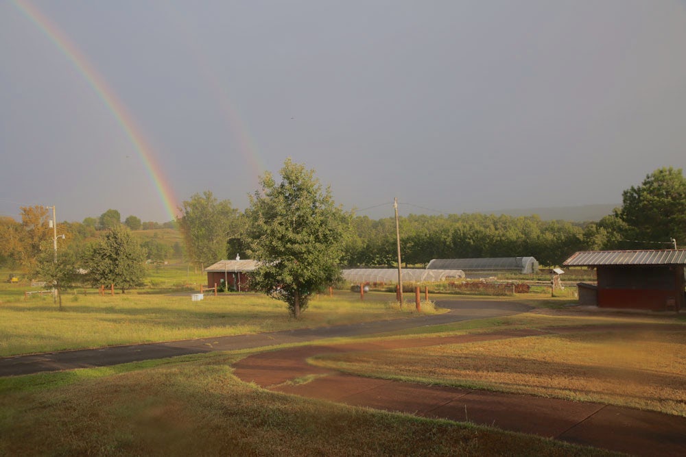 A rainbow shining over Heifer Ranch.