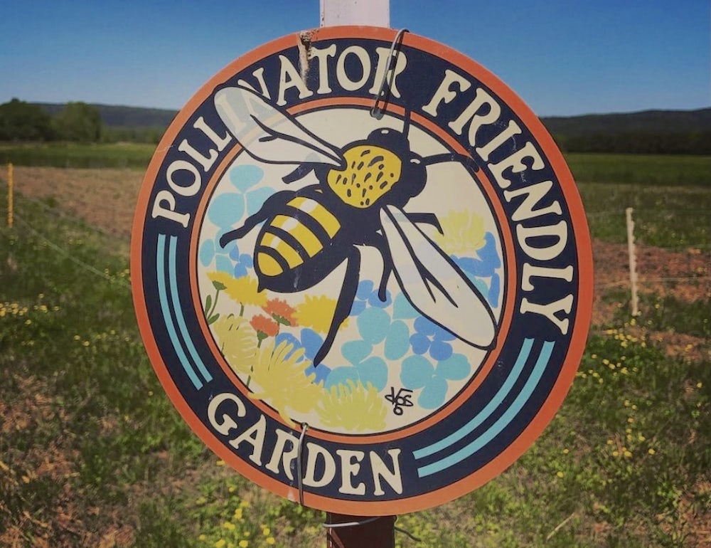 A pollinator-friendly garden sign