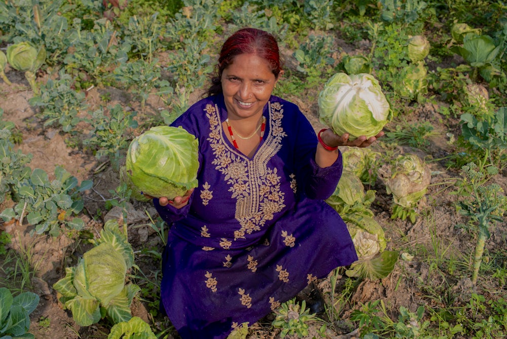 Kamala shows her vegetable production.