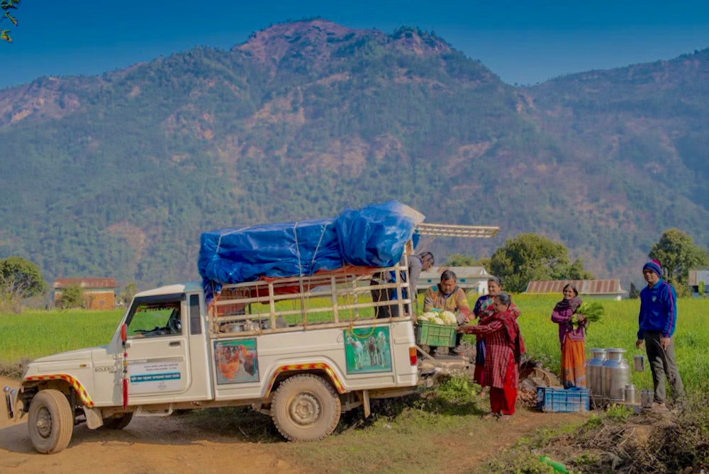 Farmers in Nepal use a truck to take their produce to market.