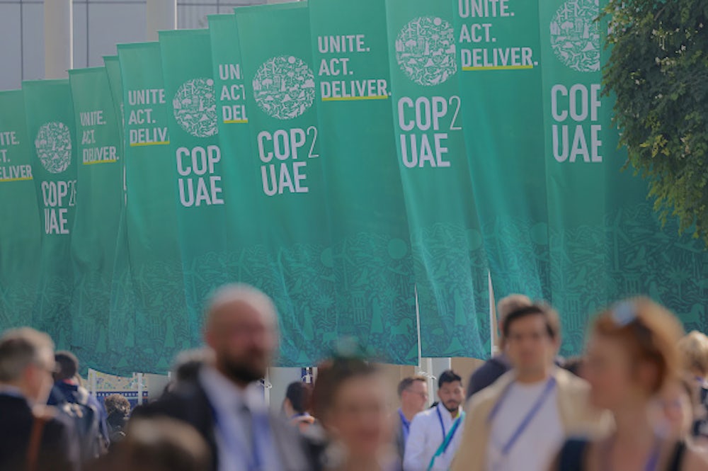 A close-up of green banners from the COP28 event.