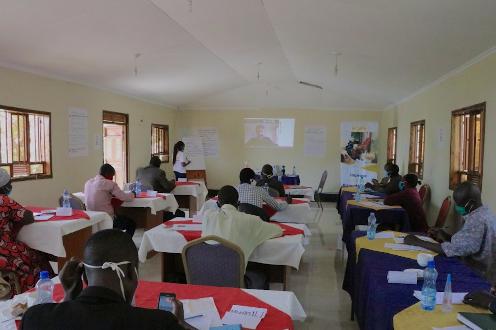 Heifer Kenya community facilitators attend a Corona Warriors training session (while maintaining social distancing and protective measures)