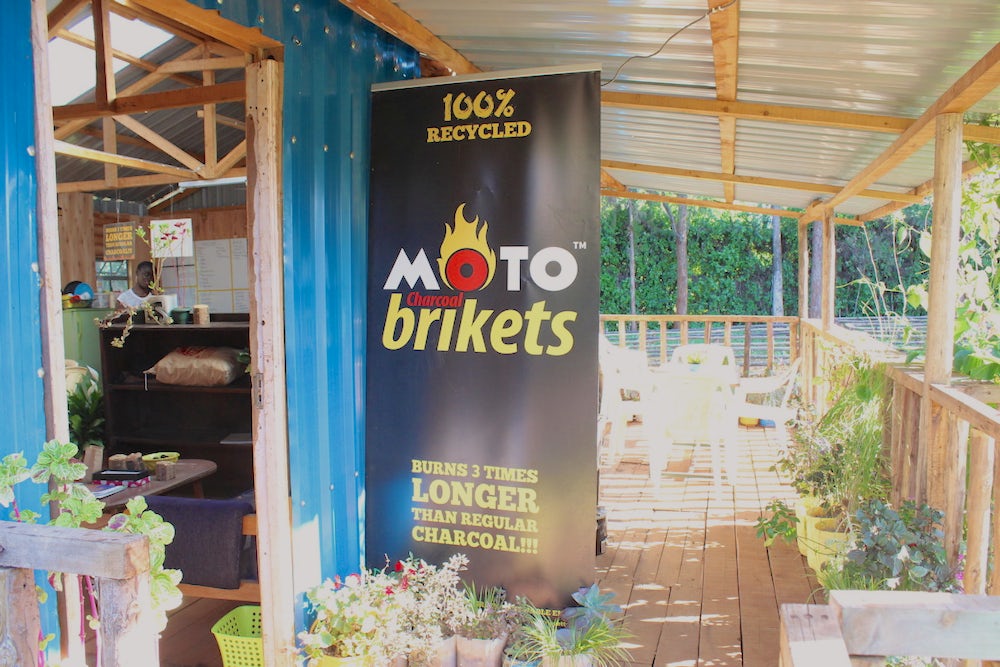 Advertising banner for Moto Brikets, a biofuel product from BrightGreeen Renewable Energy (Nairobi, Kenya), a 2017 D-Lab Scale-Ups Fellowship venture. Photo courtesy MIT D-Lab.