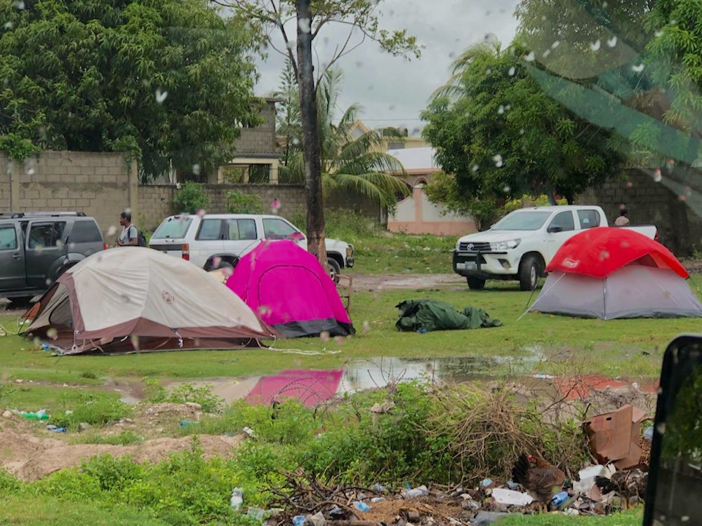 Tents are pitched in Haiti following building's destruction.