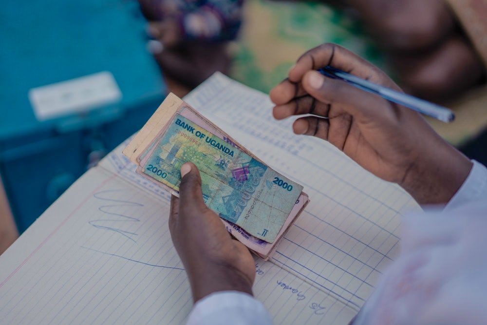 A hand counting currency notes. 