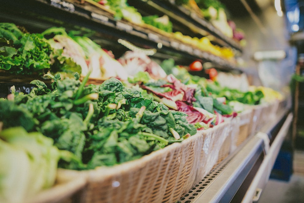 Wicker baskets filled with produce in a grocery store.