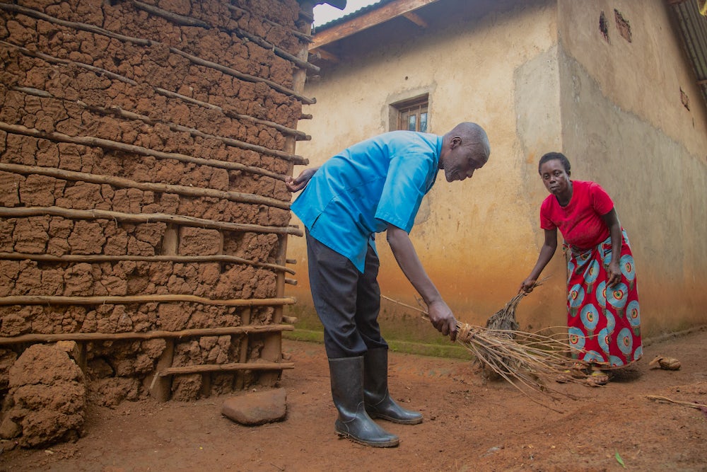 Sibomana helps his wife Beatha with household chores. There was a time when he didn't help out around the house. 