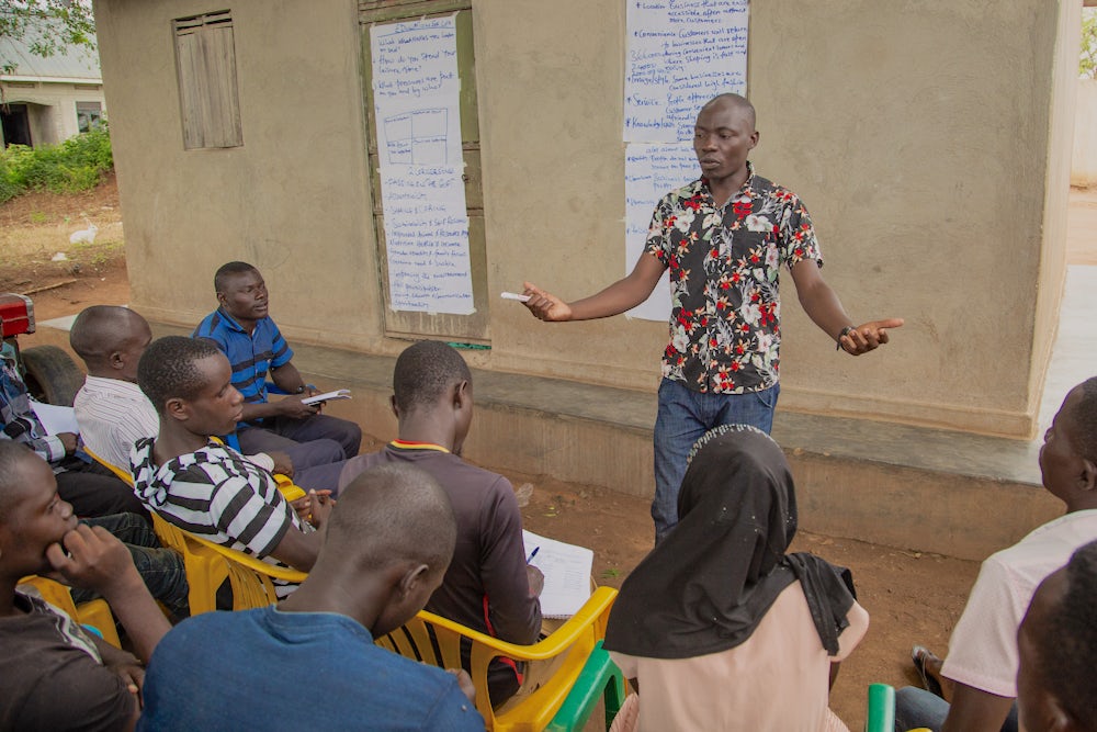 A man directs a class of East Africa Youth Inclusion Project.